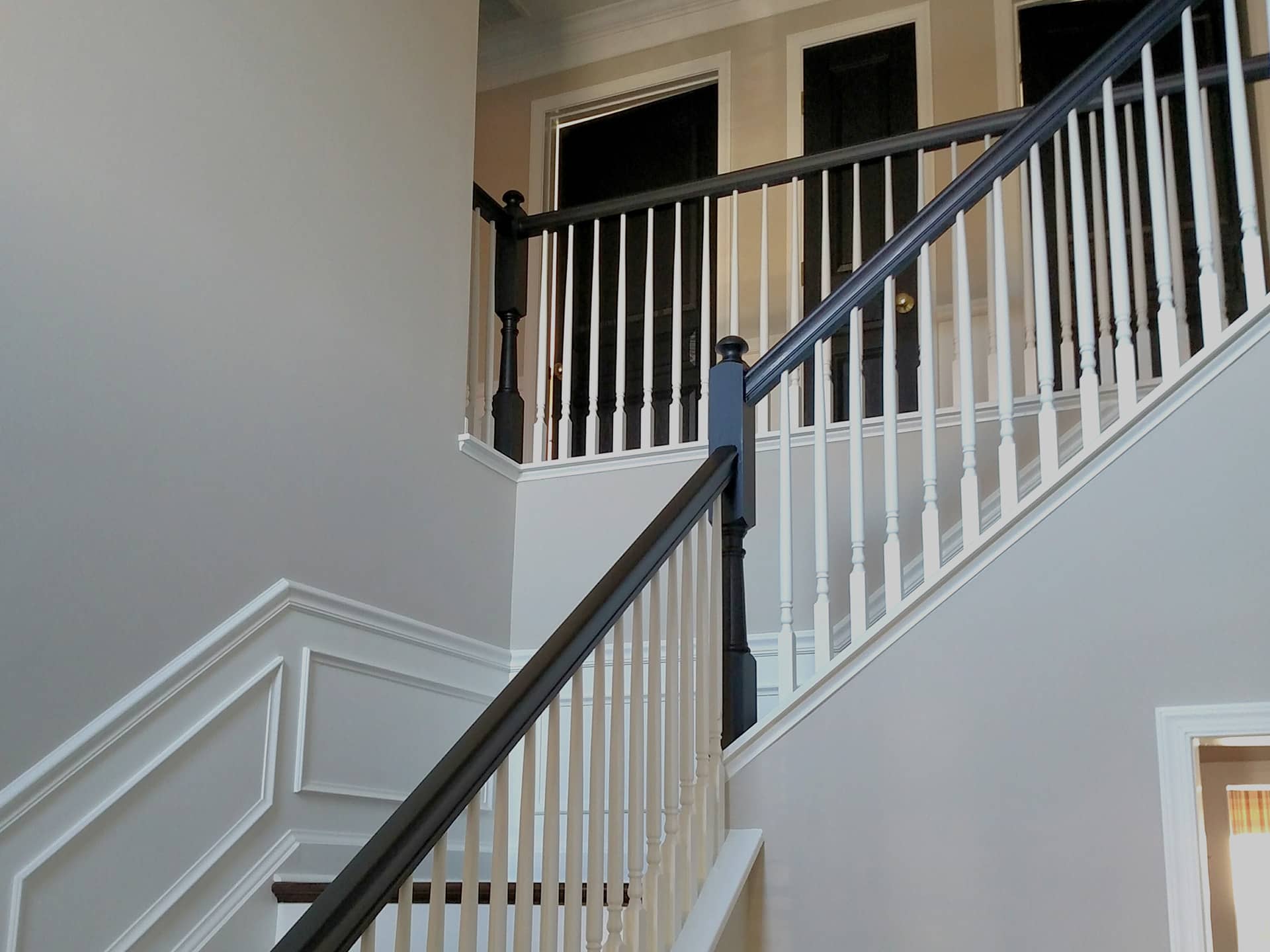 staircase with white wall